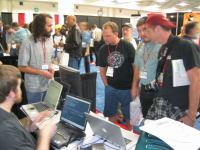 001 people at the debian booth 20040803.jpg - 2004:08:03 10:11:01