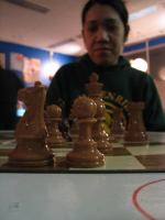 chyna watching chess at rocket 02072003.jpg - 2003:02:07 20:30:34